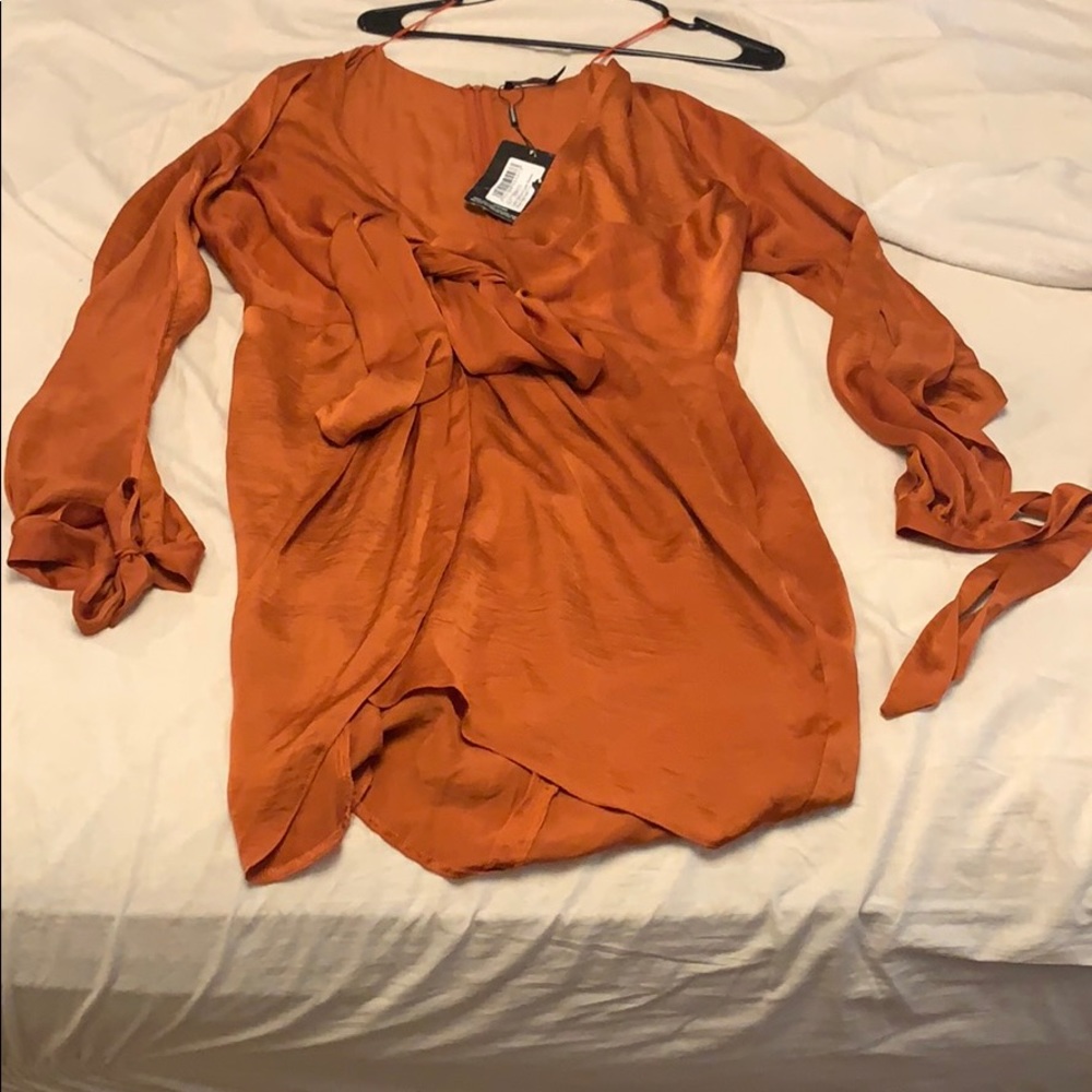 Satin wrap dress with open sleeves and wrist ties